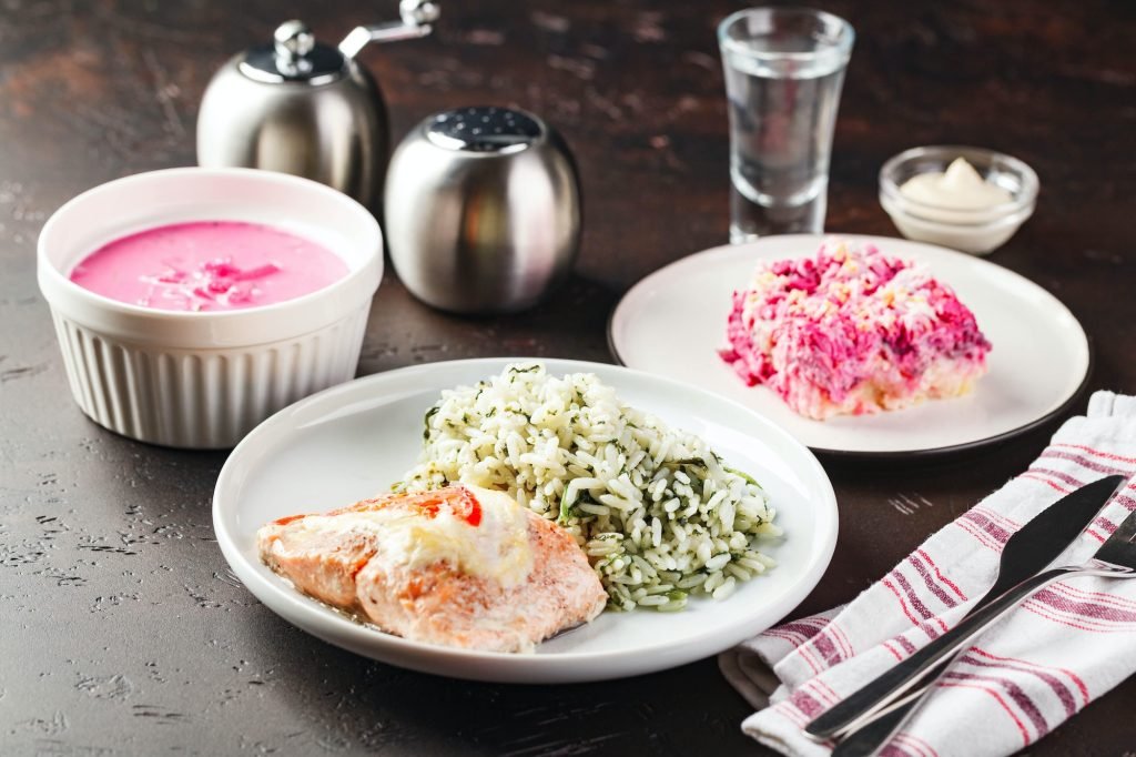 Dinner table with different dishes, three-course set of three courses soup, second course and